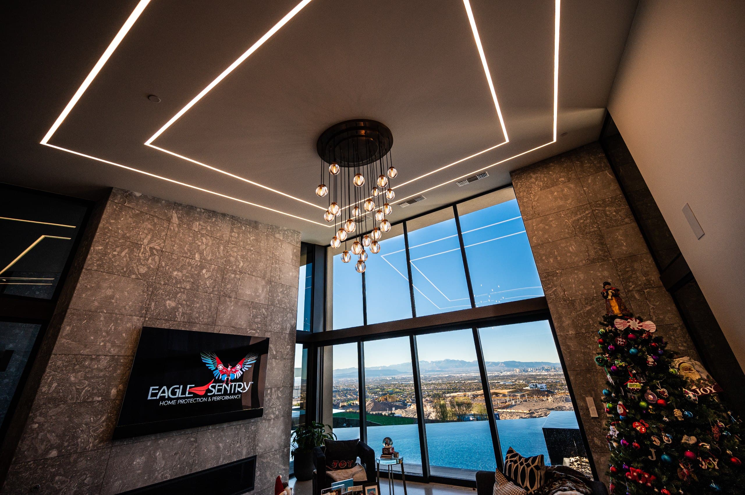 Luxury great room with linear LED ceiling and panoramic Las Vegas views