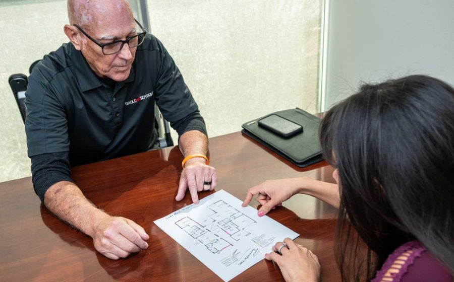 man working on blueprints